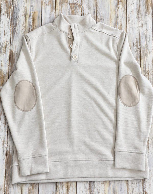 An oatmeal colored long-sleeve pullover with contrasting beige elbow patches.