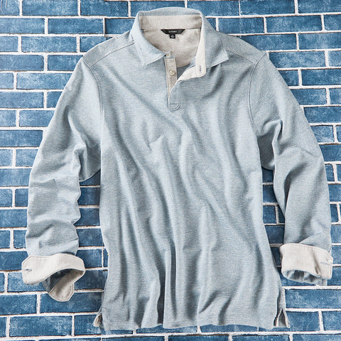 A light blue long-sleeve henley shirt with a white inner collar and cuffs.