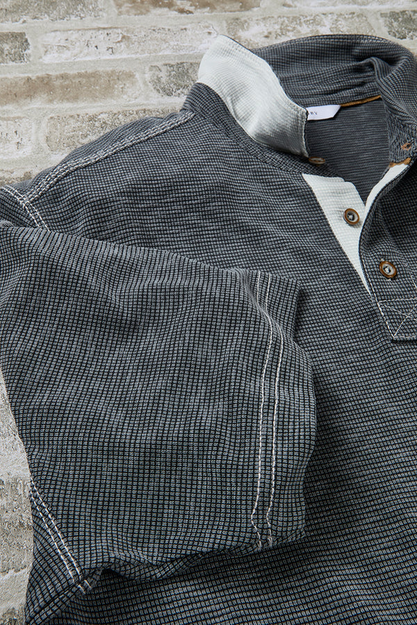 Close up of gray polo sleeves