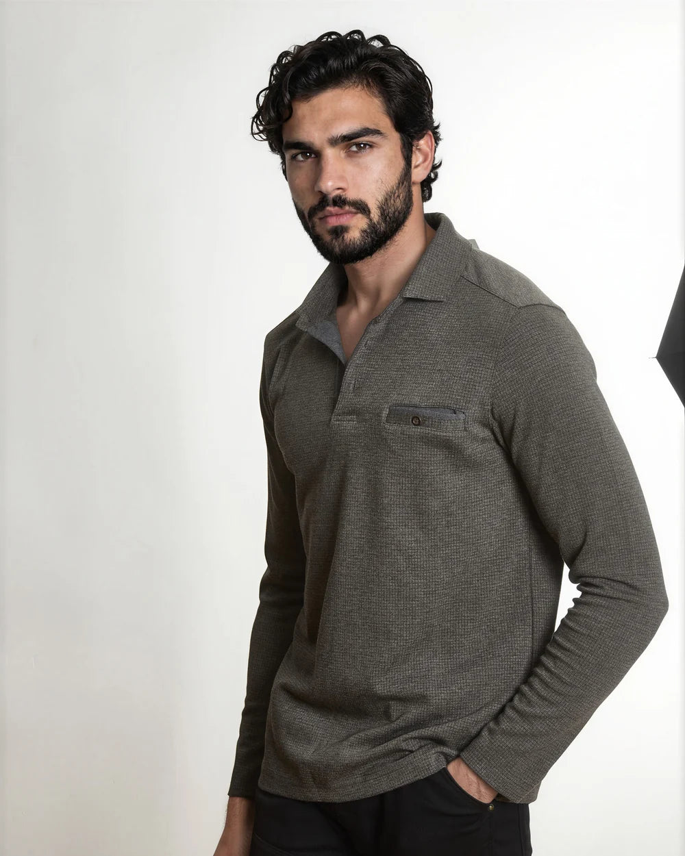 Model wearing the brown Textured Knit Long Sleeve Polo with Chest Pocket