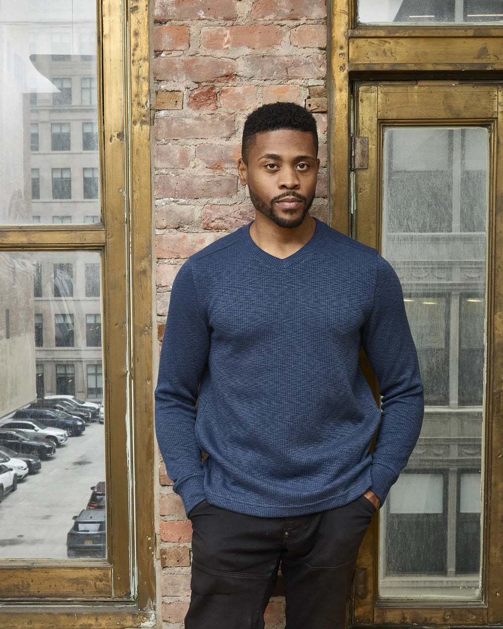 Original Nicoby model wearing the navy Rib-Textured V-Neck Pullover